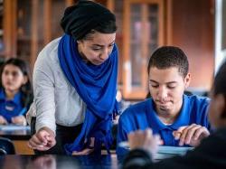 Woman and teenage student reviewing notes