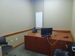 Study room with table, chairs, computer, and 白板