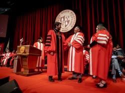 president koppell shaking hands on stage