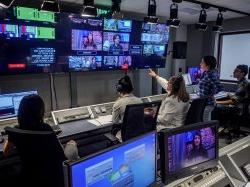 Photo of sudents in live TV production booth producing a show.